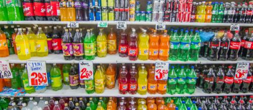 Shelf in a supermarket with products in plastic bottles (Image credit – Maksym Kozlenko/Wikimedia Commons)