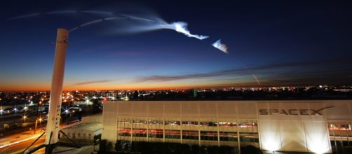 Rocket contrails over SpaceX building. Photo from SpaceX's Flickr