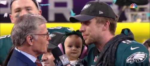 Nick Foles and his daughter accept his trophies in his Super Bowl win. - [NFL / YouTube screencap]