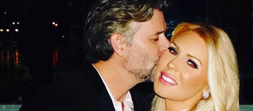 Gretchen Rossi gets a kiss from fiance Slade Smiley. [Photo via Facebook]
