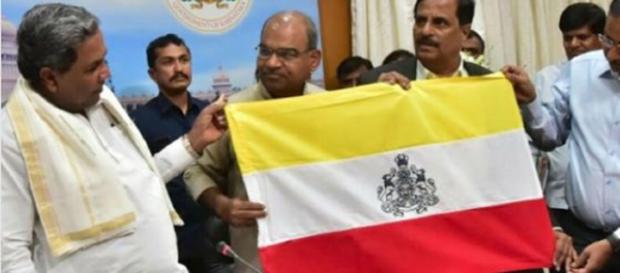 'Naada Dwaja' with red, white and yellow colours (Image Credit: Udaya Tv/Youtube) 'Naada Dwaja' with red, white and yellow colours (Image Credit: Udaya Tv/Youtube)