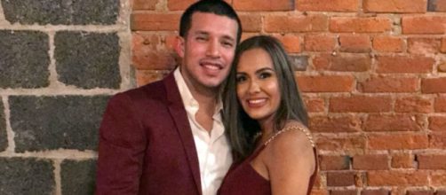 Javi Marroquin and Briana DeJesus pose in matching maroon outfits. [Photo via Instagram]