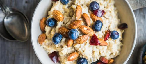Be creative with your breakfast and spice up your oatmeal with your favorite toppings. - [Image via ALENA HAURYLIK / SHUTTERSTOCK]