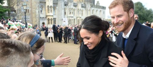 Prince Harry, Meghan Markle greeted by cheering fans in Wales ... - go.com