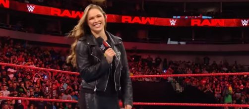 Ronda Rousey is still getting the hang of the mic work involved in pro wrestling [Image via WWE / YouTube Screencap]