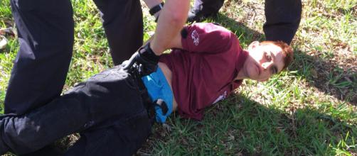 Image shows Nikolas Cruz being arrested after killing 17 students and staff -- Coconut Creek Police Department via wikimedia