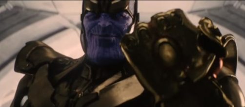 Thanos wearing his Infinity Gauntlet and preparing to get all the Infinity Stones. [Image via The Best Trailers/YouTube screencap]