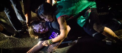 Sheriff's Vehicle hits woman at Stephon Clark protest. [image source: pinterest]