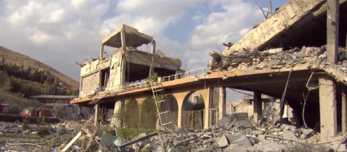 The aftermath of the air strikes in Damascus . [image source: CBS Evening News - YouTube]