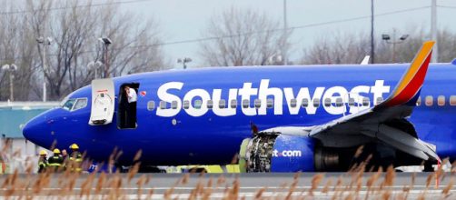 Stunned onlookers view Southwest Flight 1380. [Image via Philadelphia Inquirer/YouTube]