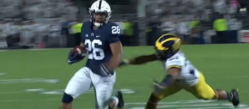 Penn State running back Saquon Barkley is expected to be amongst the top picks in the 2018 NFL Draft. [Image via ESPN/YouTube]