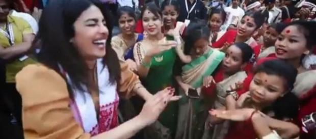 Priyanka Chopra dances Bihu with the school children in Assam (Photo credit: Priyanka/ instagram) Priyanka Chopra dances Bihu with the school children in Assam (Photo credit: Priyanka/ instagram)
