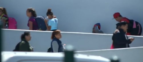 Central Americans entering CBP facility in San Ysidro, CA. [Daily Mail/YouTube]