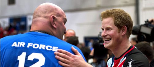 Prince Harry greets an airman during an exhibition volleyball match between U.S. and U.K. (Image credit - Tyler L. Main, Wikimedia Commons)