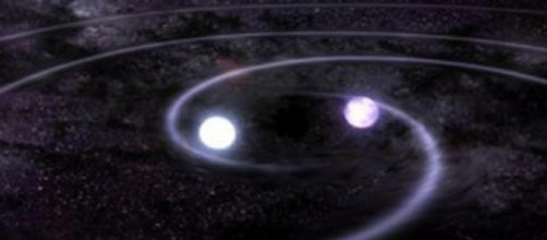 In alto, un sistema binario di stelle a neutroni