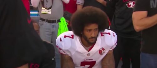 Colin Kaepernick started a movement when deciding to kneel during the national anthem. - [Image source: CBS Evening News / YouTube screenshot]