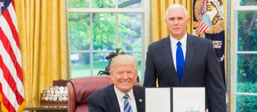 President Trump signing an executive order with VP Pence. - [White House File / Flickr]