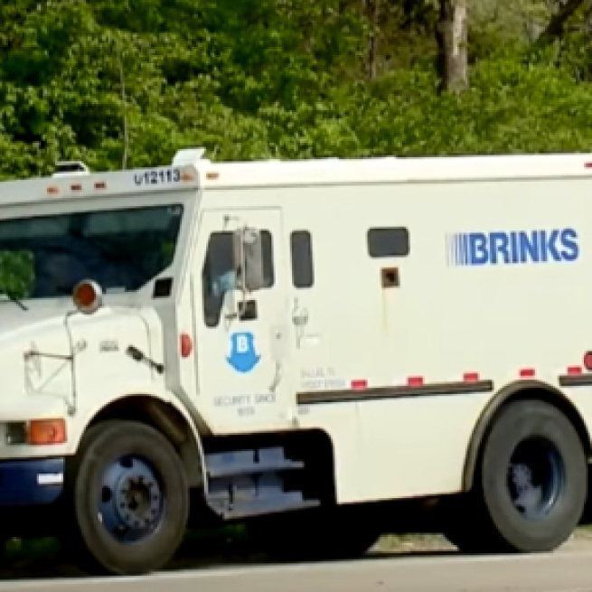 Brinks truck spills money and cops want you to give it back. Photo: NewZZCafe/YouTube screenshot