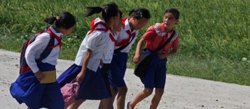 North Korean girls on the way to school. - [Image credit – Roman Harak / Wikimedia Commons]