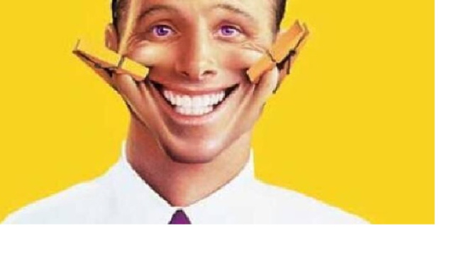 In alto, immagine di un volto sorridente