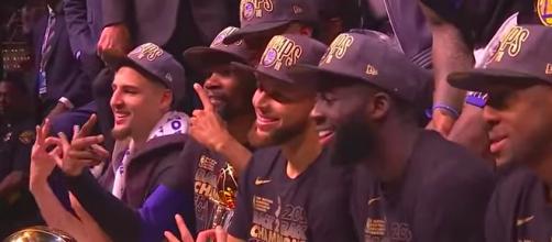 The Warriors core pose for a team picture after capturing their third NBA title in four years. - [CliveNBAParody / YouTube screenshot]