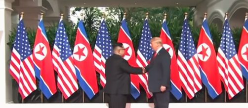 The leaders of North Korea and the United States shake hands. - [Image Source: ABC News / YouTube screencap]