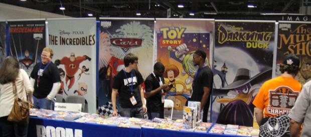 Boom! Studios comics booth (Image via: The Conmunity – Pop Culture Geek/Wikimedia Commons) Boom! Studios comics booth (Image via: The Conmunity – Pop Culture Geek/Wikimedia Commons)