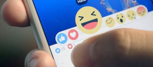 Facebook Reactions on screen - By We Are Social via Flickr]