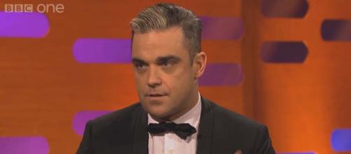 Robbie Williams believes he may have Asperger Syndrome or at least something on the autism spectrum. [Image BBC/YouTube]