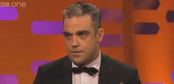 Robbie Williams believes he may have Asperger Syndrome or at least something on the autism spectrum. [Image BBC/YouTube]