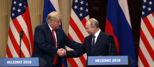 Trump shakes hands with Putin. - [Fox News / YouTube screencap]