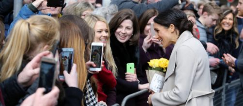 Meghan Markle interacting with women during her visit to Belfast. [Image credit – Northern Ireland Office, Wikimedia Commons]
