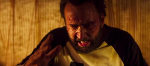 Nicolas Cage vows to hunt down the creepy killer in 'Mandy.' [Image Source: RLJE - YouTube]