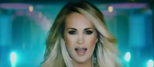Carrie Underwood is keeping her baby on the way a priority, not what fans think of the new SNF song. [Image Source: NBAgamingboy - YouTube]