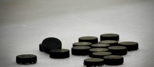 A group of hockey pucks on ice, much like the ones used by Zetterberg. [Image via StrategicWebDesign_Net - Pixabay]
