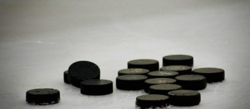 A group of hockey pucks on ice, much like the ones used by Zetterberg. [Image via StrategicWebDesign_Net - Pixabay]