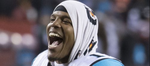 Cam Newton has led his team to a first place tie going into the bye. [Image source: Kieth Allison - Wikimedia Commons]