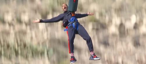 Will Smith was challenged to go bungee jumping over the Grand Canyon from a helicopter for his 50th birthday. [Image Will Smith/YouTube]