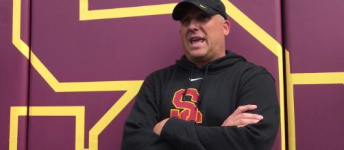 USC's Head Coach Clay Helton is one of several coaches on the hot seat. - [USCAthletics / YouTube screencap]