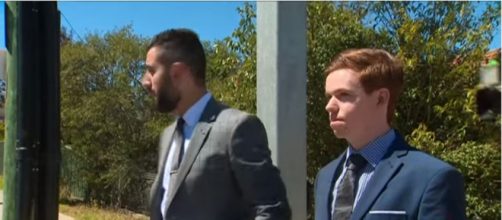 Munday (right) and his lawyer after the sentence. [Image source: 7NEWS Australia/YouTube]