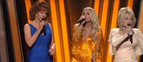 Reba McEntire, Carrie Underwood, and Dolly Parton open the 2019 CMA Awards in dazzling tribute to female greats. [Image Source: CMAVEVO/YouTube]