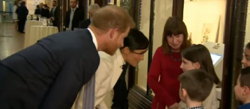 Prince Harry and Meghan arrive at the Natural History Museum for a glam gala performance. [Image source/The Royal Family Channel YouTube video]