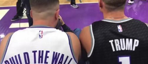Sacramento Kings fans Daniel Goldsmith and Pete Molinelli wore controversial jerseys to game. [Image Source: Sacramento Bee - YouTube]