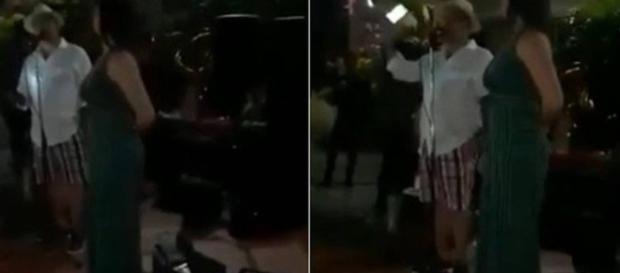 Durante a festa, o venezuelano revela quem é o amante de sua mulher. (Reprodução/Youtube) Durante a festa, o venezuelano revela quem é o amante de sua mulher. (Reprodução/Youtube)