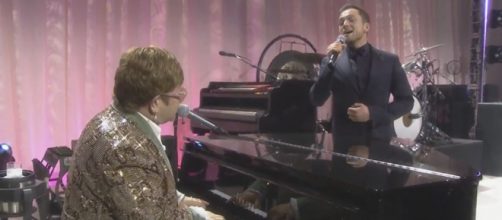 Taron Egerton and Elton John sing a duet of "Tiny Dancer." [Image AMC Theatres/YouTube]