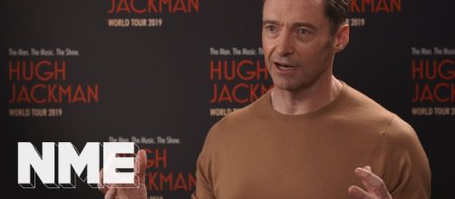 Hugh Jackman goes singing and dancing in world tour. [Source: NME/YouTube]