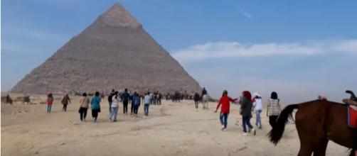 Tourists visit in Great Pyramid of Giza, in Egypt. [Charles Huang/YouTube/Screencap]