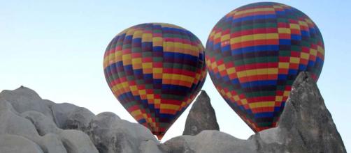 Take a hot air balloon ride to Cappadocia in Turkey. [Image Ahsioz/Wikimedia Commons]
