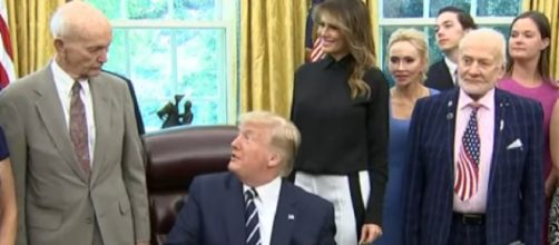 Trump marks Apollo 11 anniversary in a meeting with two veteran astronauts. [Image source: Associated Press /YouTube]