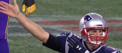 Tom Brady signals a first down after reaching the 1,000-rushing yard mark (Image Credit: Boston Sport/YouTube)
